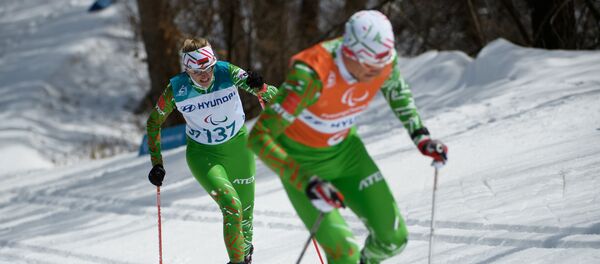 Ведущий Роман Ященко и Светлана Сахоненко на Паралимпиаде в Пхенчхане Ведущий Роман Ященко и Светлана Сахоненко на Паралимпиаде в Пхенчхане - Sputnik Беларусь