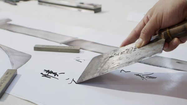 Китайский каллиграф рисует иероглифы поварскими ножами - Sputnik Беларусь