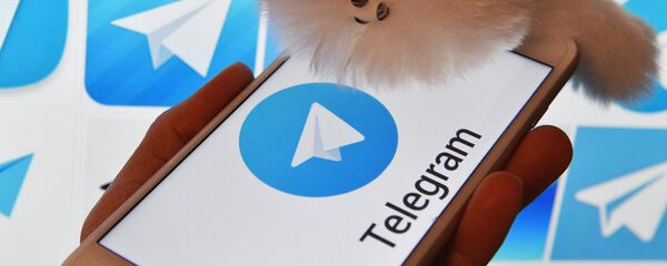 Лагатып мессенджера Telegram на экранах смартфона і камп'ютара Лагатып мессенджера Telegram на экранах смартфона і камп'ютара - Sputnik Беларусь