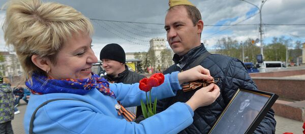 Удзельнік акцыі Бессмяротны полк у Мінску Удзельнік акцыі Бессмяротны полк у Мінску - Sputnik Беларусь