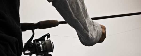 Рыболов с удочкой, архивное фото - Sputnik Беларусь