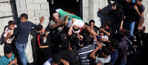 Прощание с палестинцем, который был убит во время акции протеста на границе Израиля и Газы - Sputnik Беларусь