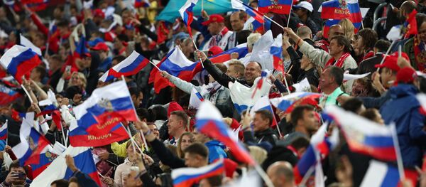 Российские болельщики после матча группового этапа чемпионата мира по футболу между сборными России и Египта Российские болельщики после матча группового этапа чемпионата мира по футболу между сборными России и Египта - Sputnik Беларусь