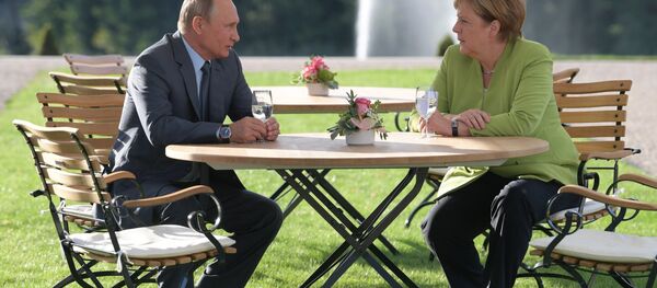 Президент РФ Владимир Путин и федеральный канцлер ФРГ Ангела Меркель Президент РФ Владимир Путин и федеральный канцлер ФРГ Ангела Меркель - Sputnik Беларусь