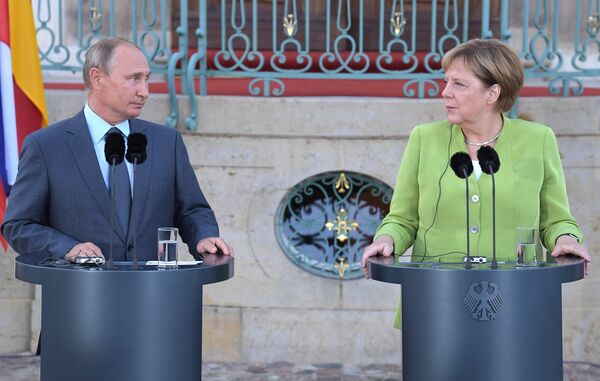 Президент РФ Владимир Путин и федеральный канцлер ФРГ Ангела Меркель Президент РФ Владимир Путин и федеральный канцлер ФРГ Ангела Меркель - Sputnik Беларусь