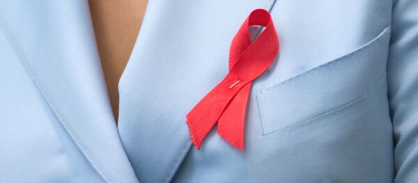 Значкі Чырвоная стужачка, якія сімвалізуюць барацьбу са СНІДам Значкі Чырвоная стужачка, якія сімвалізуюць барацьбу са СНІДам - Sputnik Беларусь