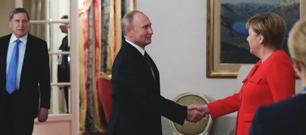 Президент РФ Владимир Путин и канцлер Федеративной Республики Германии Ангела Меркель во время встречи на полях саммита Президент РФ Владимир Путин и канцлер Федеративной Республики Германии Ангела Меркель во время встречи на полях саммита - Sputnik Беларусь