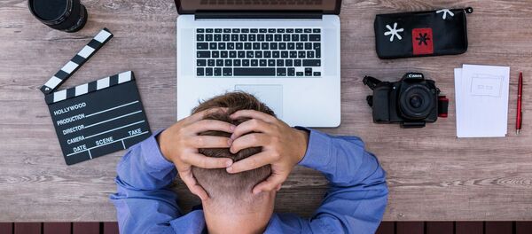 Программист грустит, архивное фото Программист грустит, архивное фото - Sputnik Беларусь