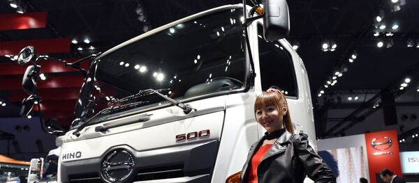 Модель на моторшоу в Токио, архивное фото - Sputnik Беларусь