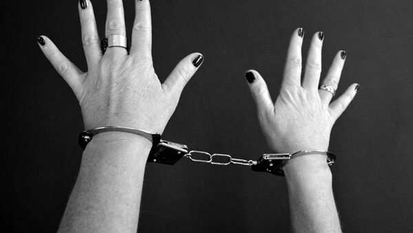 Женщина в наручниках, архивное фото - Sputnik Беларусь