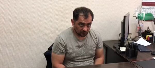 Кадры с задержанным по делу об убийстве экс-спецназовца в Подмосковье - Sputnik Беларусь