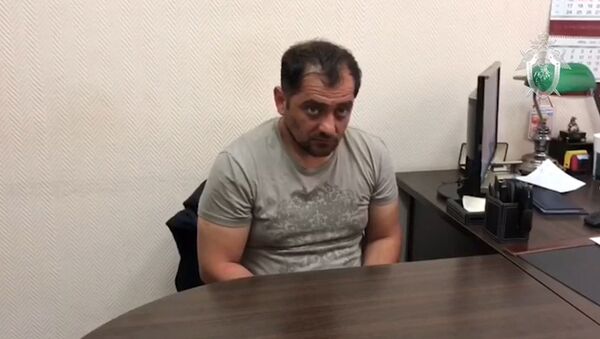 Кадры с задержанным по делу об убийстве экс-спецназовца в Подмосковье - Sputnik Беларусь