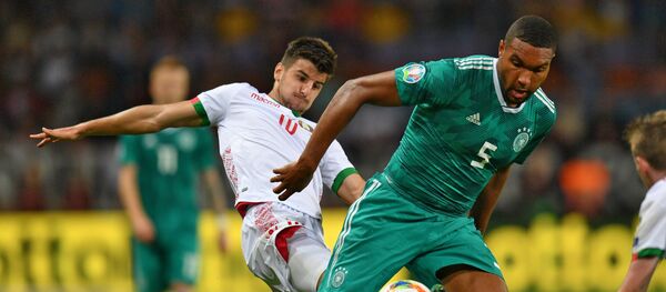 Полузащитник белорусской сборной Валерий Громыко в матче против команды Германии - Sputnik Беларусь