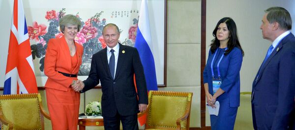 Владимир Путин и Тереза Мэй во время встречи в рамках саммита Группы двадцати G20 в Ханчжоу, 2016 год - Sputnik Беларусь