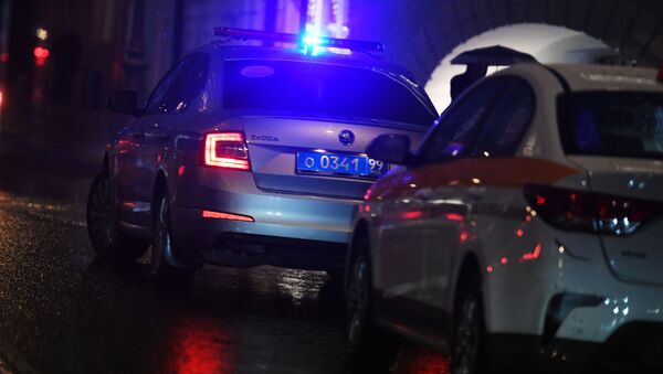 Автомобиль полиции на дороге во время дождя - Sputnik Беларусь