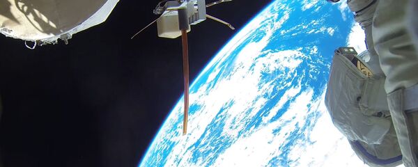 Космонавты во время выхода в открытый космос. архивное фото - Sputnik Беларусь