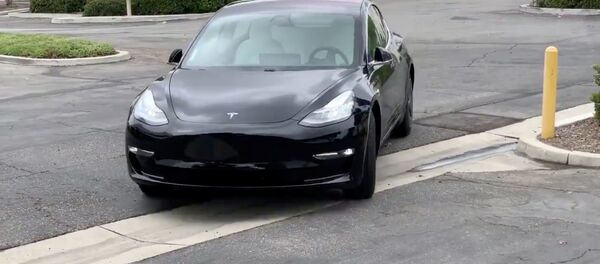 Автомобиль Tesla - Sputnik Беларусь