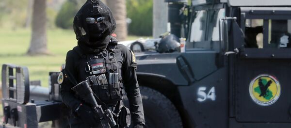 Боец спецподразделения по борьбе с терроризмом на улице Багдада - Sputnik Беларусь