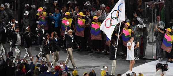 Представители сборной беженцев во время парада атлетов на Играх-2020 - Sputnik Беларусь