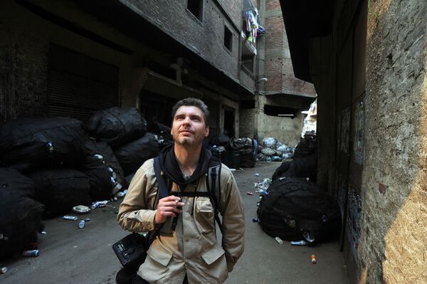 Фотокорреспондент Андрей Стенин на улице Каира. Фото из архива. - Sputnik Беларусь