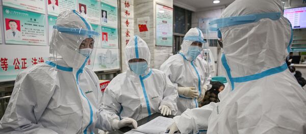 Медицинские работники в защитной одежде - Sputnik Беларусь
