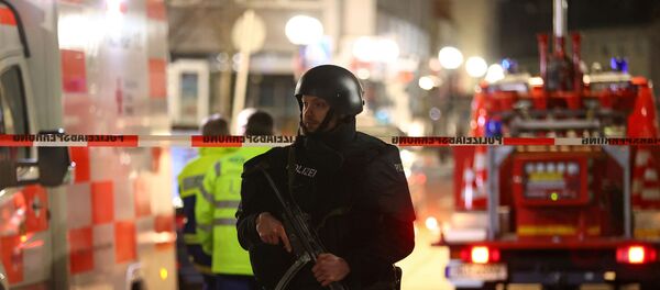 Полицейское оцепление в Ханау, на месте стрельбы в кальянных и букмейкерской конторе - Sputnik Беларусь