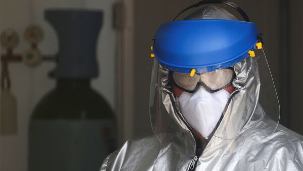 Медик в Мехико во время пандемии коронавируса - Sputnik Беларусь