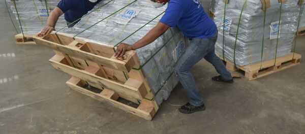 Сотрудники Организации Объединенных Наций организуют доставку гуманитарной помощи - Sputnik Беларусь