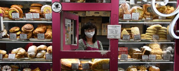 Продавец в маске, архивное фото - Sputnik Беларусь