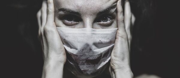 Женщина в маске, архивное фото - Sputnik Беларусь
