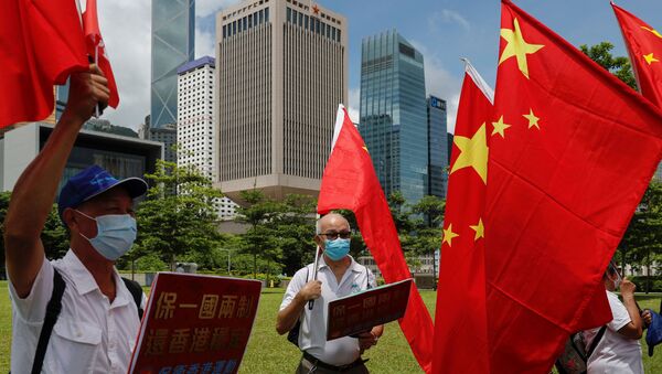 Сторонники Китая празднуют принятие закона о безопасности Гонконга - Sputnik Беларусь