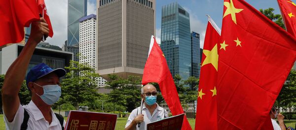 Сторонники Китая празднуют принятие закона о безопасности Гонконга - Sputnik Беларусь